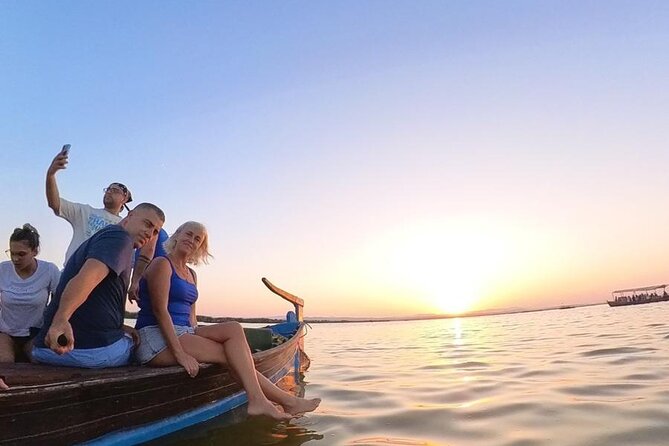 Excursion to the lagoon, sunset and boat ride. - From Valencia to Platja de la Garrofera: dunes, pines, and long coastline views