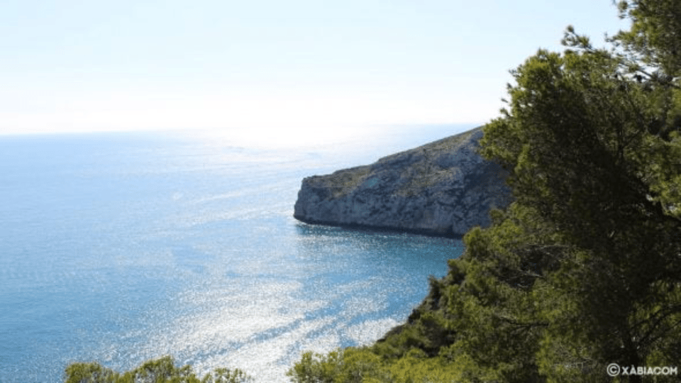 Exploring Costa Blanca's Hidden Beach Treasures - Granadella Beach: serene Javea cove water and cliff views