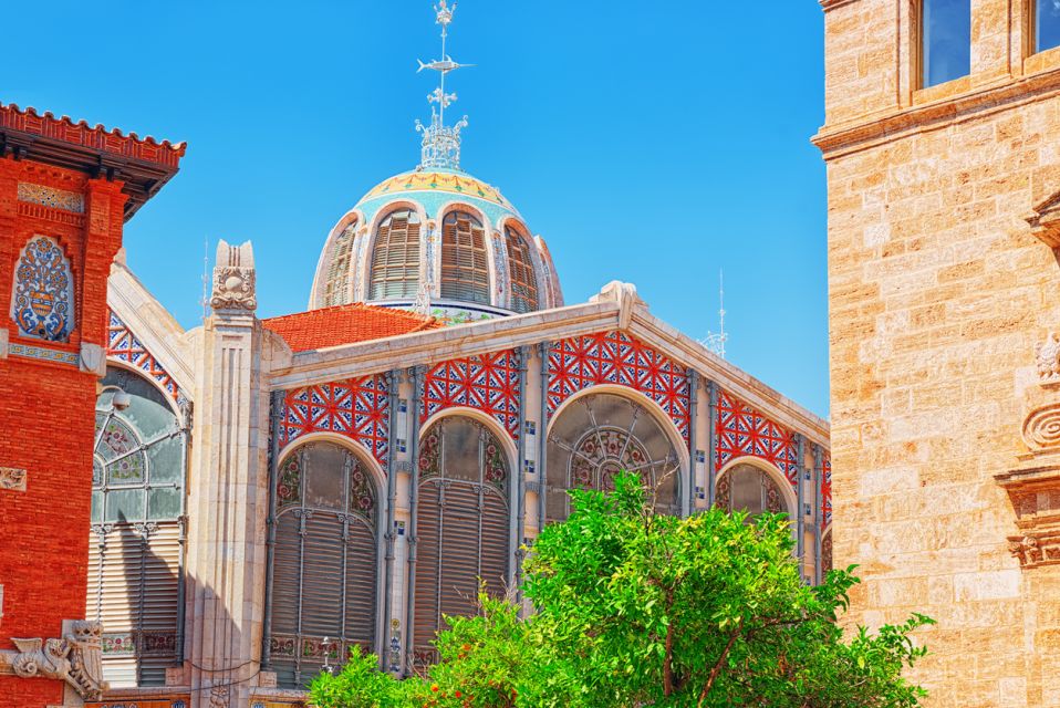 Valencia: Historic Center Audio-Guided Tour with Earphones - Church stops: what to look for around Santos Juanes and the cathedral zone
